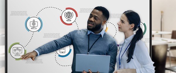 Male teacher interacting with students with the LG CreateBoard in the background